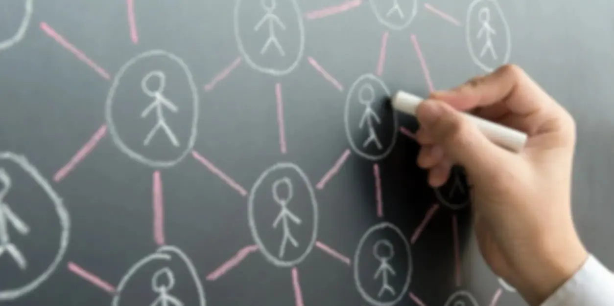 A person drawing on the wall of a social network.